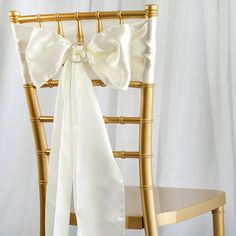 a chair with a white bow on it