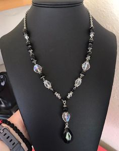 This pretty silver tone wire strung mixed black and clear faceted and variegated Lucite bead necklace is 23 inches long with a front decorative drop that is 2 3/8 inches long. The largest black teardrop front bead is 20mm tall and 15mm wide and the larger round aurora borealis beads are 13mm. This is classic timeless closet basic necklace. It has a sturdy lobster claw and chain closure. I specialize in finding fun wearable jewelry. Please browse my shop for more options. I box jewelry sales in n Mixed Bead Necklace, Basic Necklace, Timeless Closet, I Box, Wearable Jewelry, Wire Cuff, Copper Bracelet, Box Jewelry, Aurora Borealis