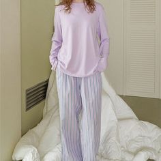 Discover comfort and style with Ever Lasting's Solid Long Sleeves and Striped Pants Pajama Set. Perfect for lounging at home or sleeping in luxury, this pajama set combines comfort and style to give you a restful night's sleep. With solid long sleeves and striped pants, it's a versatile set that offers both warmth and breathability. Whether you're unwinding after a long day or enjoying a leisurely weekend, this pajama set ensures both comfort and style. Features: 100% Grade A Cotton Unisex Style Hidden Pockets Relax Fit (stretchy waistband) Breathable (great for all seasons) Machine Safe General Size Guide: Size S/M -> Size 0 - 4 Size M/L-> Size 4 - 8 Size L/XL -> Size 8 - 12 Looking for more coziness? Shop our loungewear collection. Relaxed Fit Long Sleeve Loungewear Set, Comfortable Pajama Party Sets With Long Pants, Comfortable Long Pants Sets For Pajama Party, Relaxed Fit Sleep Set With Long Pants, Relaxed Fit Long Pants Set For Relaxation, Relaxed Fit Sets With Long Pants For Relaxation, Relaxed Fit Bedtime Sets With Long Pants, Bedtime Sets With Relaxed Fit Long Pants, Cotton Loungewear Pant Set