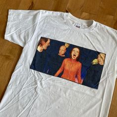 "This piece is a vintage t-shirt from the late 1990s for the American rock band, Garbage. This white tee has a big graphic on the front with an image of all the band members; Shirley Manson,  Duke Erikson, Steve Marker and Butch Vig. On the back is the URL for the bands website across the shoulders.  -100% Cotton -Single Stitch -No Major Stains, Yellowing, or Flaws Tag Size: Large, fits slightly smaller *refer to measurements for true fit* Pit to Pit: 20.5\" Length: 27.5\" Please also assess the White 90s T-shirt For Concert, White Custom Print Grunge T-shirt, White Y2k T-shirt For Concert, Y2k White T-shirt For Concert, Y2k Style White T-shirt For Concerts, Pop Culture White T-shirt For Concerts, White Pop Culture T-shirt For Concerts, American Vintage Clothing, Band Website