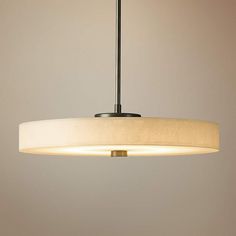 a light fixture hanging from a ceiling in a room