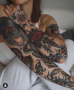 a woman with tattoos on her arms and arm