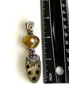 "Artisan Fossil gemstone pendant Hand-made Sterling Silver 925 Stones used: Baltic Amber, Ammonite-Fossil, Ruby, Pearl, Garnet, Citrine Height - 2 3/4\" (with bail), Width - 3/4\" Unique Handcrafted One-of a-kind Design Pendant Each Piece of Jewelry in my Collection is Absolutely One of a Kind! When you start wearing a piece of my jewelry you will fall in love with it more and more each day and feel that good Energy and Love that I pass into it while creating this piece of Art. A piece of Art cr Unique Pearl Pendant Jewelry, Heart Pendant Multi-stone Jewelry Gift, Multi-stone Heart Pendant Jewelry As Gift, Artisan Sterling Silver Pearl Pendant Jewelry, Artisan Sterling Silver Jewelry With Pearl Pendant, Unique Pearl Pendant Necklace For Anniversary, Fusion Style Pearl Pendant Jewelry As Gift, Fusion Style Pearl Pendant Jewelry For Gift, Unique Pearl Pendant Jewelry Gift