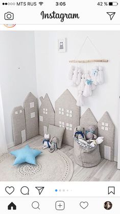 a baby's room is decorated in gray and white