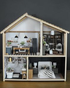 a doll house with furniture and accessories in it