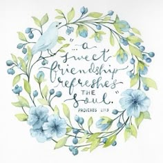 a watercolor painting with blue flowers and a bible verse on the front, surrounded by green leaves