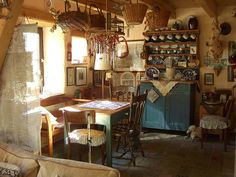 an old fashioned kitchen and dining room are shown