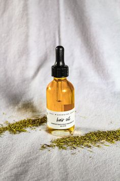 2 oz Glass Bottle | Vegan Friendly | Gluten Free | 100% Organic & Wildcrafted Ingredients The only hair oil you'll ever need! A 3 in 1 all natural plant based oil for daily use, heat protection, or scalp treatment. Handcrafted for all hair types in need of repair, moisture, thickness, length, flexibility, shine & protection. Instructions Daily | Add a small amount of oil to the palm of your hand, rub hands together & apply to hair after showering or in the morning to tame any loose hairs. Heat P Hair Oil Organic, Hair Oil Business Aesthetic, Hair Oil Photography Ideas, Hair Oil Product Photography, Hair Oil Photography, Hair Oil Packaging Design, Hair Oil Aesthetic, Hair Oil Bottle, Hair Advertising