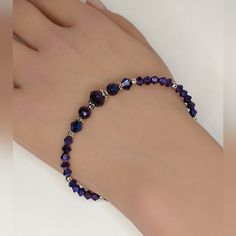 Super Sparkly Bracelet In Irredescent Purple Crystals Accented With Detailed Silver-Plated Beads. Adjustable From 7 1/2 To 8. Crystals Are Purple But The Metallic Finish Will Give Flashes Of Blue, Even Though In The Pics A Lot Of The Crystals Look Blue. All Jewelry Branded Swarovski Or Arsinoe Are Handmade By Me And With The Cost Of Materials, Packaging And Poshmark's Fee I Don't Have Much Wiggle Room On The Price. Any Clothing Or Unbranded Jewelry I Do Have Wiggle Room. Thank You For Understand Elegant Nickel Free Crystal Bracelet For Party, Elegant Nickel-free Crystal Bracelet For Party, Faceted Crystal Bracelet For Parties, Adjustable Nickel-free Crystal Bracelet For Party, Nickel-free Round Bead Bracelets For Party, Round Beads Crystal Bracelet For Party, Crystal Bracelet For Party, Party Crystal Bracelet With Round Beads, Adjustable Crystal Bracelet With Polished Beads For Parties