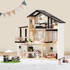 a doll house with furniture and accessories on the floor