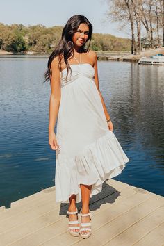 - Whether you are headed to a beachside brunch, a rooftop party, or a leisurely stroll through the park, this fabulous dress is your go-to choice for casual elegance! - Lightweight material - A built-in lining - A halter tied sweetheart neckline that goes down into a drawstring ruched detail - An interior non-slip strip - A smocked back - Functional side pockets - A flowy and flattering silhouette that ends in a ruffled high-low hemline Measurements S : Bust 26-28", Hip 42", Length 39", Slip Len Flowy Sundress For Brunch During Beach Season, Beachy Midi Dress For Brunch During Beach Season, Chic Beach Dress For Summer Parties, Chic Strapless Dress For Beach Party, Chic Midi Sundress For Summer Parties, Strapless Summer Midi Dress For Beach, Flowy Sundress For Brunch And Vacation, Strapless Midi Dress For Summer Beach, Breezy Maxi Dress For Vacation Brunch