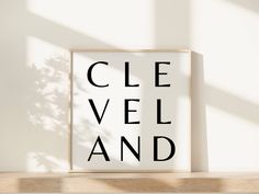 a close up of a framed object on a shelf with the words cle vel and