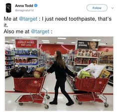 a woman pushing a shopping cart through a store