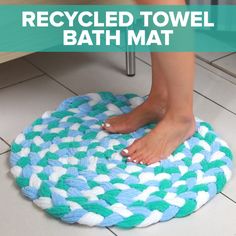 a blue and white rug sitting on top of a floor next to a wooden table