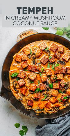 an overhead view of a creamy mushroom and coconut sauce in a cast iron skillet