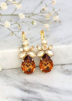 Amber Crystal Drop Earrings, Bridal Amber Crystal Drop Earrings, Autumn Wedding Jewelry, Bridal Honey Crystal Lever Back Crystal Earrings Dazzling lever back Cluster Crystal earrings feature a Marquise teardrop and Diamond cut crystals set on secure prong settings.  The perfect shade for cocktail parties or to add a touch of color to your wedding ensemble Details :  ♥ Materials- 18k Gold Plated, Silver Over Brass, Premium Quality European Crystals  ♥ Choose your style of plating at checkout  ♥ U Fall Wedding Jewelry, Drop Earrings Bridal, Jewel Tone Wedding, Bridal Earrings Drop, Amber Crystal, Fantasy Wedding, Jewelry Bridal, Cocktail Parties, Autumn Wedding