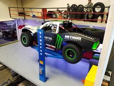 a monster truck on display in a garage