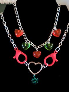 Green Necklaces For Valentine's Day Party, Handmade Themed Jewelry For Valentine's Day, Valentine's Day Themed Heart Jewelry, Valentine's Day Heart Shaped Themed Jewelry, Valentine's Day Heart-shaped Themed Jewelry, Heart-shaped Jewelry With Lobster Clasp For Parties, Party Heart Necklace With Lobster Clasp, Heart-shaped Necklace With Lobster Clasp For Party, Red Heart-shaped Novelty Jewelry