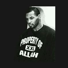 a black and white photo of a man wearing a shirt that says property of aliah