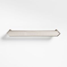 a metal shelf with an arrow design on the top and bottom, against a white background