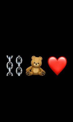 a teddy bear sitting next to two metal chains and a red heart on black background