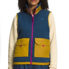 The North Face Royal Arch Fleece Vest Coat Brand: The North Face Condition: New With Tags $149.00 Size: Womens Us Small Color: Blue & Yellow (Navy Blue With A Mustard/Gold Hue Yellow) *The Blue Was Hard To Capture In Photos, There Will Be Slight Variances In Color Through Photos* Description: The North Face Royal Arch Fleece Vest Is A Conventional Outerwear Piece With A Fashionable Aesthetic. Premium Material Construction Keeps Your Guarded Against The Elements While A Combination Of Unique And Blue Sleeveless Vest For Outdoor Activities, Sleeveless Blue Outerwear For Outdoor Activities, Sleeveless Blue Outdoor Outerwear, Sleeveless Blue Outerwear For Outdoor, Blue Fall Vest With Pockets, Blue Vest With Pockets For Fall, Functional Blue Vest For Winter, North Face Fleece Vest, Puffer Vest With Hood