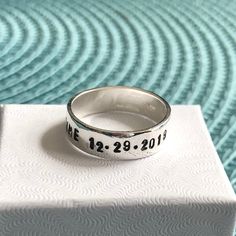 Sterling silver memorial ring personalized with a name, date of passing, inspirational phrase- perfect remembrance gift for men and women to honor a loved one. - Sterling silver, hand stamped band measures 6mm. - Personalize with up to 30 characters. -Hand stamped rings will stretch slightly when stamped, so more letters = more stretching. HOW TO ORDER: 1. Select Your Drop Downs. 2. Add to cart. 3. Leave me a note in the message to seller during checkout with your personalization up to 30 charac Memorial Engraved Sterling Silver Ring, Memorial Silver Jewelry With Engraved Text, Unique Silver Ring For Memorial, Spiritual Silver Ring For Memorial, Symbolic Sterling Silver Engraved Ring, Personalized, Stackable Birthstone Rings, Hand Stamped Ring, Memorial Ring, Stamped Rings