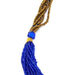 This multi- strand bead necklace is made by hand by the Maasai women in Kenya. | This multi- strand bead necklace is made by hand by the Maasai women in Kenya. No two are exactly alike, making each piece a truly unique work of art! Maasai beadwork embodies the whole of Maasai culture representing beauty, strength, tradition, warriorhood, social status and their deep love and devotion for their cattle. The age old artform is practiced by women of the village who learn from their mothers, who lear Maasai Culture, Multi Strand Beaded Necklace, Social Status, Lapis Blue, Maasai, Deep Love, Multi Strand Necklace, Artisan Craft, Blue And Gold