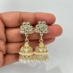 Small Light weight kundan Jhumka/kundan Jhumka/Indian Jewelry/Pakistani/Punjabi/Indian/Statement earring/Bridal earring/Indian wedding Lightweight and elegant Height = 48 mm || Width = 17 mm Pearl Jhumki Indo Western Earring Can be paired with any dress Closure: Pushback This is 100% Handmade jewelry. So Color, shades, texture displayed may slightly vary from the actual product due to digital image limitations. We request you to consider these minor variations. Please expect the possibility of s Dangle Jhumkas For Wedding And Navratri, Wedding Dangle Jhumkas For Navratri, Kundan Jhumkas With Gota Work For Festivals, Festival Kundan Jhumkas With Gota Work, Festive Kundan Jhumkas For Wedding, Kundan Bridal Earrings With Tilla For Navratri, Navratri Kundan Bridal Earrings With Tilla, Kundan Meenakari Jhumkas For Diwali, Heavy Bollywood Style Dangle Jhumkas