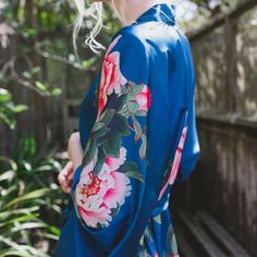 Wrap up in beautiful botanicals and step into a sanctuary all your own. Find your favorite via link in bio! photo: @jenniferskog Bohemian Wedding Robe With Kimono Sleeves, Wedding Robe With Kimono Sleeves For Spring, Spring Wedding Robe With Kimono Sleeves, Summer Wedding Open Front Kimono, Wrap Kimono For Spring Wedding, Spring Wedding Wrap Kimono, Blue Kimono With Tie Waist, Pink Bohemian Kimono For Wedding, Pink Bohemian Wedding Kimono