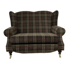 a brown and green plaid chair with wooden legs