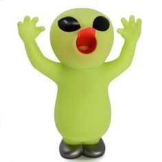 a green plastic toy with black eyes and red nose, arms up in the air