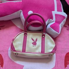 Playboy Off White Mini Purse Bag Pink Extra Small Holes On Left Side There Might Be Some Small Tears Or Marks Between And Around The Small Holes Cute White Top Handle Bag, Vintage White Pouch Bag, Vintage White Satchel For Shopping, White Retro Pouch Bags, Retro White Satchel Shoulder Bag, White Retro Shoulder Bag Satchel, White Retro Top Handle Shoulder Bag, White Retro Satchel For Shopping, Vintage White Bag For Errands