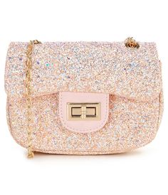 From GB Girls, this handbag features:Glitter sequin material chain strap crossbody silhouetteflip clasp closure Spot wipe cleanImported. Glitter Handbag, Sequin Material, Dog Tutu, Plush Backpack, Classic Wardrobe Staples, Sparkles Glitter, Dog Dresses, Chloe Drew, Gold Cross