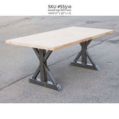 a wooden table sitting on top of a cement floor next to a parking lot with the words sku ess 5110