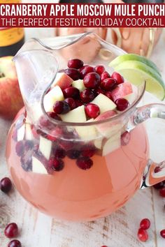 cranberry apple moscow mule punch in a pitcher