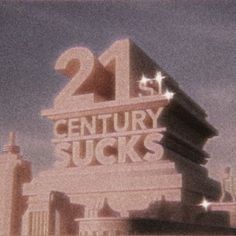 the 21st century sucks sign is lit up in front of a building with stars on it