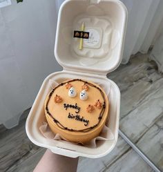 a birthday cake in a foam container with candles on it that says happy birthday to you