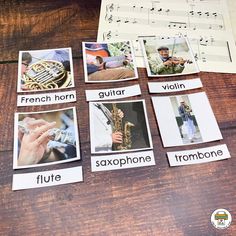 french horn, violin, saxophone, flute and sheet music cards on a wooden table