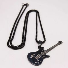 Stainless Steel Pendant. Stainless Steel Chain. Lobster Clasp Closure. Black Metal Rock Style Jewelry, Black Metal Rocker Jewelry, Black Metal Rocker Style Jewelry, Black Rocker Style Metal Jewelry, Black Chain Necklace For Concert, Black Rock Style Jewelry For Concerts, Black Metal Necklaces For Concerts, Black Chain Jewelry For Concerts, Edgy Black Stainless Steel Necklace