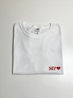 a white t - shirt with the words mum trust printed on it's chest