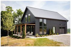 a large black house with lots of windows