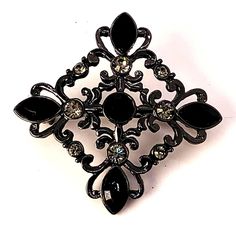 Vintage Black and Grey Brooch Pin with Rhinestones In excellent condition. Measures approx 1.5 x 1.5 x .25 inches. PIN0238 Gothic Formal Jewelry Brooch, Black Brooch Pins For Evening, Black Gothic Jewelry Brooch, Black Gothic Brooch Jewelry, Black Gothic Brooch, Vintage Black Brooch Lapel Pin, Black Rhinestones Brooch For Gift, Multi Strand Bracelet, 19 Days