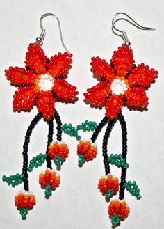 https://www.etsy.com/listing/206369196/native-american-earrings-huichol?ref=shop_home_active_21 Red Bohemian Flower Earrings, Bohemian Red Flower Earrings, Adjustable Red Flower Beaded Earrings, Red Beaded Flower Shaped Jewelry, Handmade Red Flower Beaded Earrings, Red Flower Beaded Earrings With Dangling Beads, Bohemian Red Jewelry With Flower Decoration, Orange Flower Earrings With Colorful Beads For Gift, Red Flower Earrings With Ear Wire