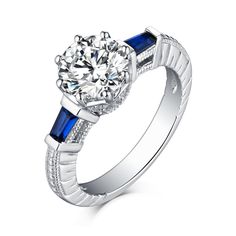 Captivating tapered baguette sapphire are bar-set in this elegant ring, brilliantly framing the center round cut moissanite. With a delicate band, this vintage ring evokes classic beauty. Features Moissanite was originally found in meteorites(Chemical name: Silicon Carbide). It was first discovered in 1893, while a scientist was examining meteor samples from a crater in Arizona. After many years, the experts has been recreated moissanite in the laboratory, that make the gemstone with friendly, a Classic Sapphire Baguette Cut Ring, Classic Diamond White Sapphire Ring With Baguette Cut, Timeless Sapphire Ring With Diamond Baguette Cut, Timeless Sapphire Baguette Cut Ring With Diamond Details, Timeless Sapphire Baguette Cut Ring, Sapphire Diamond Ring With Baguette Cut, Timeless Sapphire Baguette Cut Ring With Prong Setting, Elegant Lab-created Sapphire Ring With Channel Set, Classic White Gold Sapphire Ring With Baguette Cut