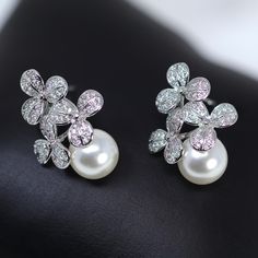 These Beautiful Romantic Swarovski Crystal BRIDAL Stud Earrings are made of very fine quality of Swarovski Crystals available in silver finish for your special day! Even we have hard time taking pictures because of their shine 😄 so we want to shine our brides on their special days. The material used in these earrings are free from Lead, Nickel, Cadmium so it will not give you any skin irritation and environment friendly too.. They measure about 1.8cm long and 1 cm wide  ► ABOUT YOUR ORDER * All items are neatly packaged in our beautiful jewelry boxes and elegant organza bags. * All items are 100% gift-ready. * Each order comes with a personalized handwritten card and a branded Millennium Bride jewelry cloth. * Each order comes with a free gift. ► PERSONALIZTION * If your order is a gift, Silver Flower-shaped Bridal Earrings For Formal Occasions, Silver Diamond Flower-shaped Bridal Earrings, Flower-shaped Cubic Zirconia Bridal Earrings, Flower-shaped Cubic Zirconia Crystal Earrings For Wedding, Silver Cubic Zirconia Flower-shaped Earrings, Bridal Earrings Studs, Crystal Bridal Earrings, Bride Jewellery, Wedding Jewelry Earrings