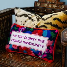 a pillow with a message on it that says i'm too clumpy for fragile masculiniity