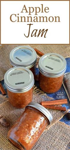 three jars filled with cinnamon jam sitting on top of a table