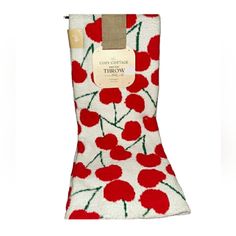 a pair of socks with red flowers on them