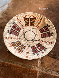 a woven basket sitting on top of a stone floor